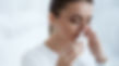 Woman using nasal spray.