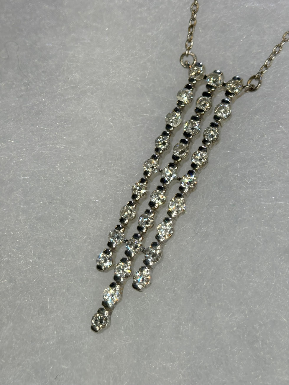 Thumbnail: Triple-strand diamond drop pendant in yellow gold