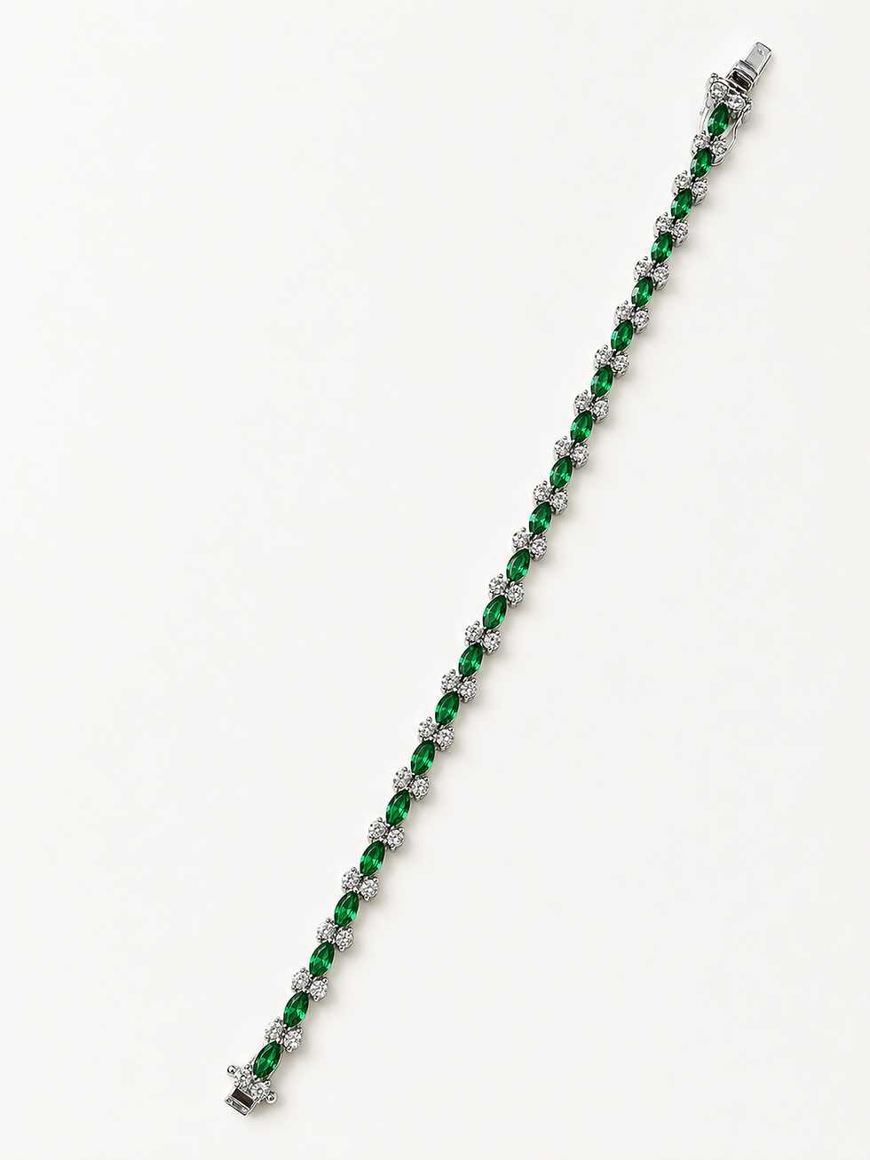 Silver tennis bracelet with alternating small green stones
