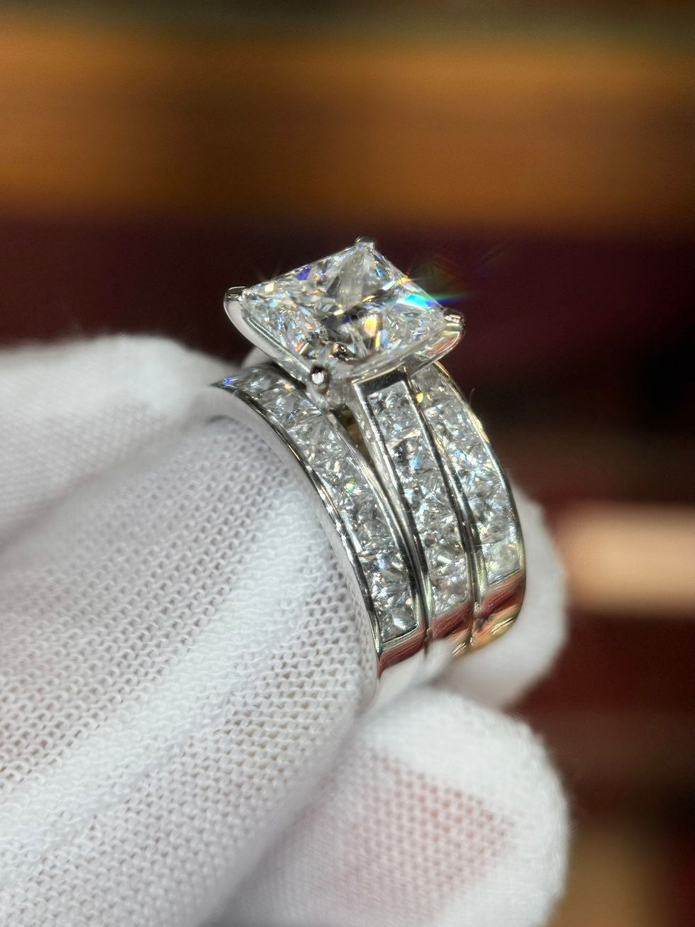 Thumbnail: Princess cut diamond ring set with triple channel bands