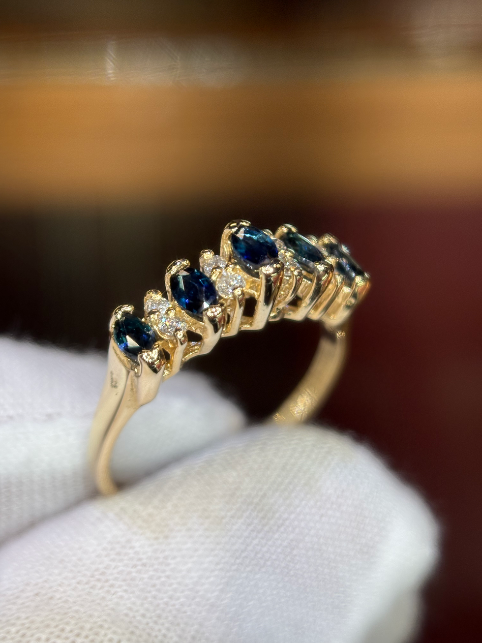 Thumbnail: Gold band with oval sapphires and round diamonds