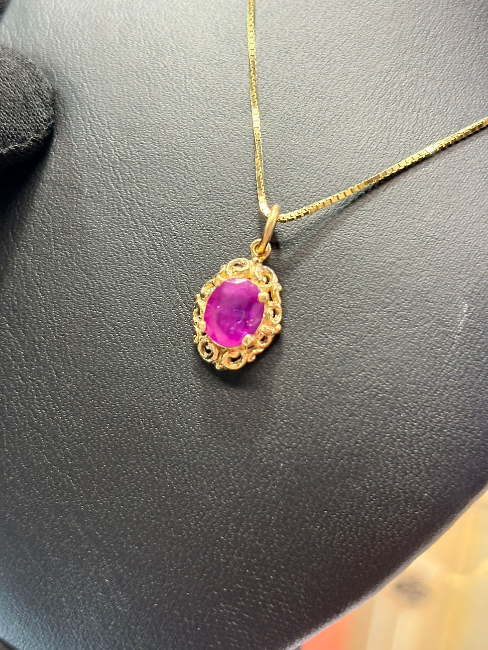 Thumbnail: Oval pink gemstone pendant in a gold filigree setting