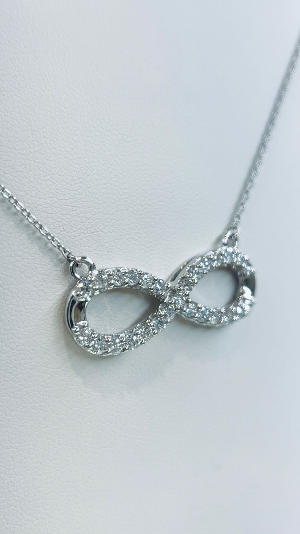 Thumbnail: Silver infinity pendant necklace with small diamonds