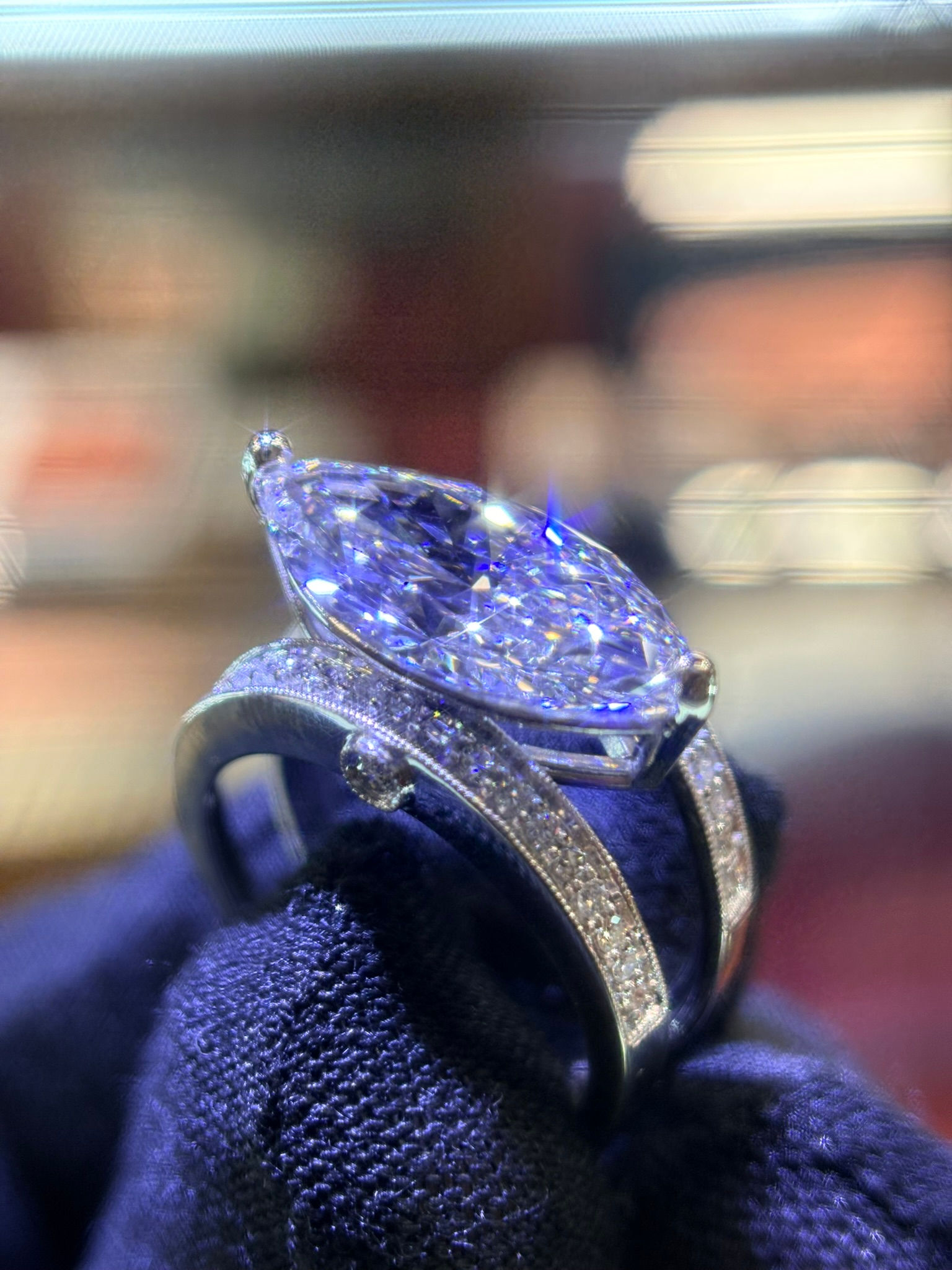 Marquise cut diamond ring with a pavé set band