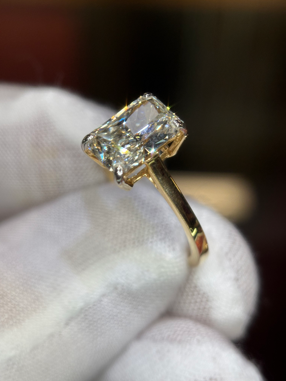 Thumbnail: Large radiant cut diamond ring on a gold band