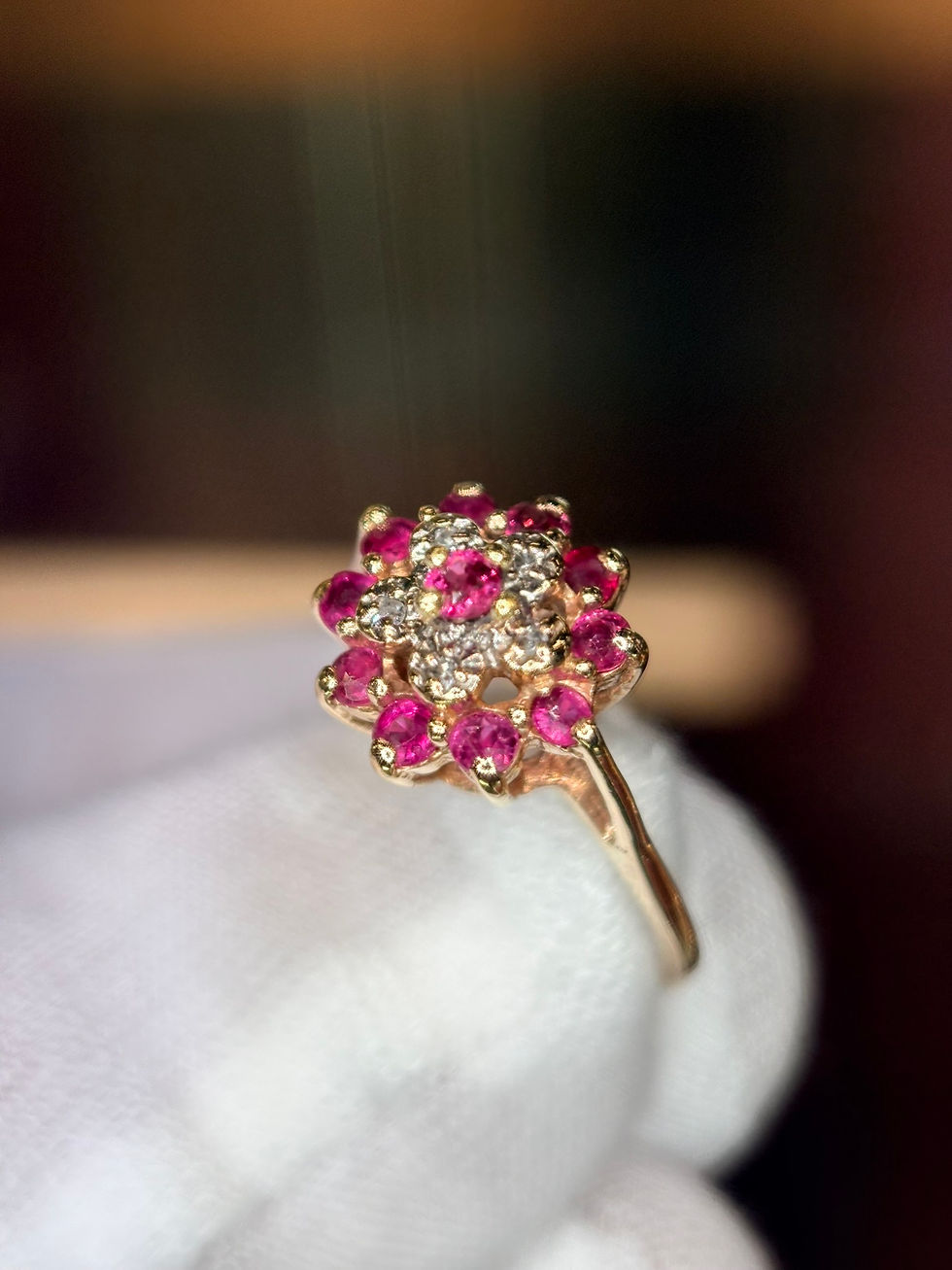 Thumbnail: Gold ring with a flower-shaped ruby and diamond cluster.