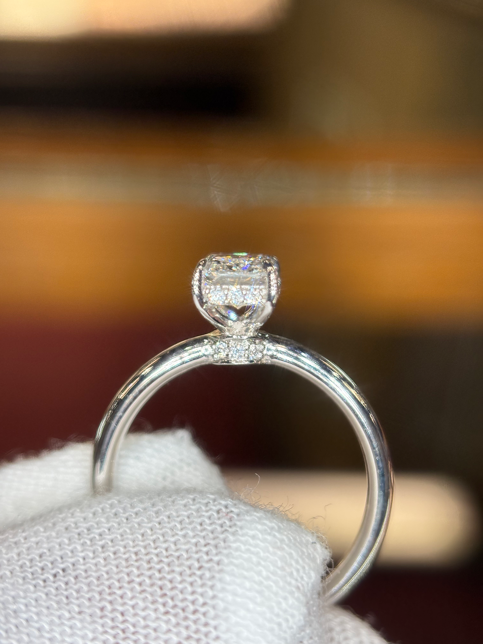 Thumbnail: Profile of a silver ring with a square cut diamond