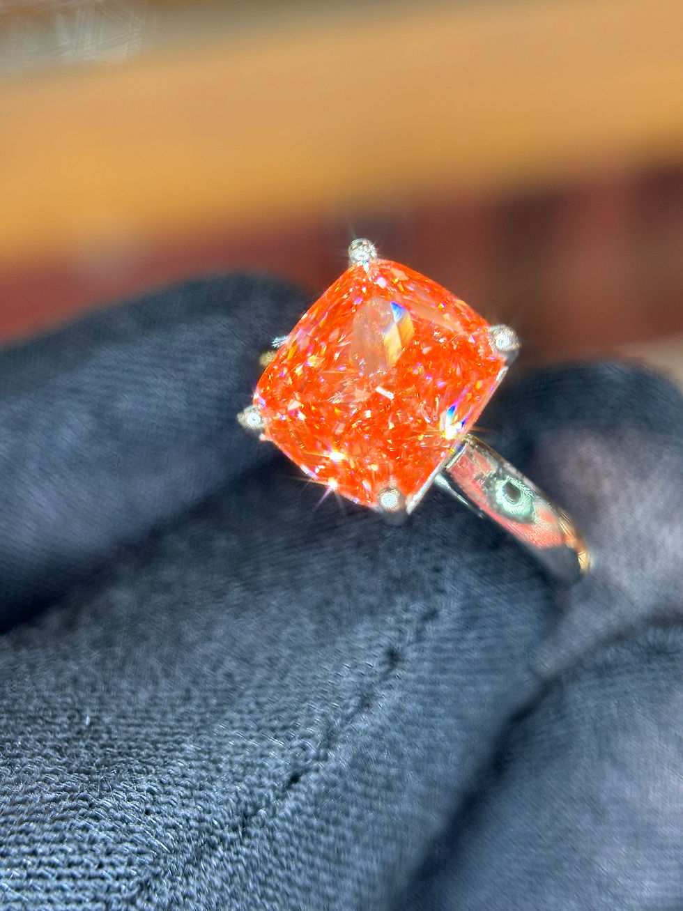 Thumbnail: Cushion-cut orange gemstone ring in a four-prong setting