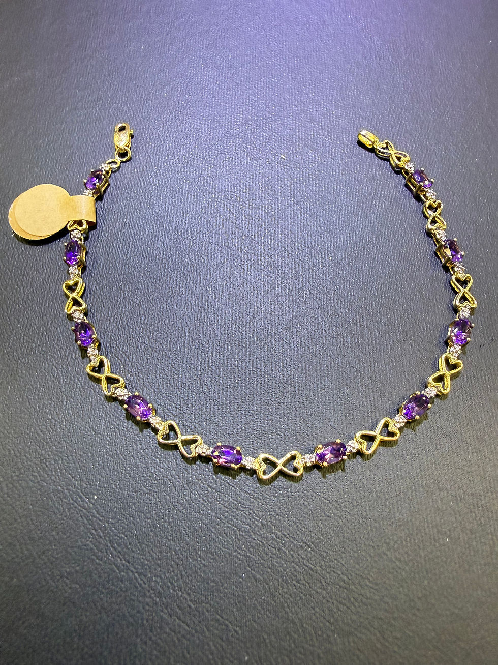 10K yellow gold bracelet with oval natural amethysts and open heart links