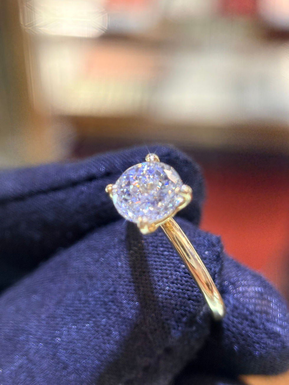 Thumbnail: Side view of a 1ct ruby and diamond ring on a gloved hand