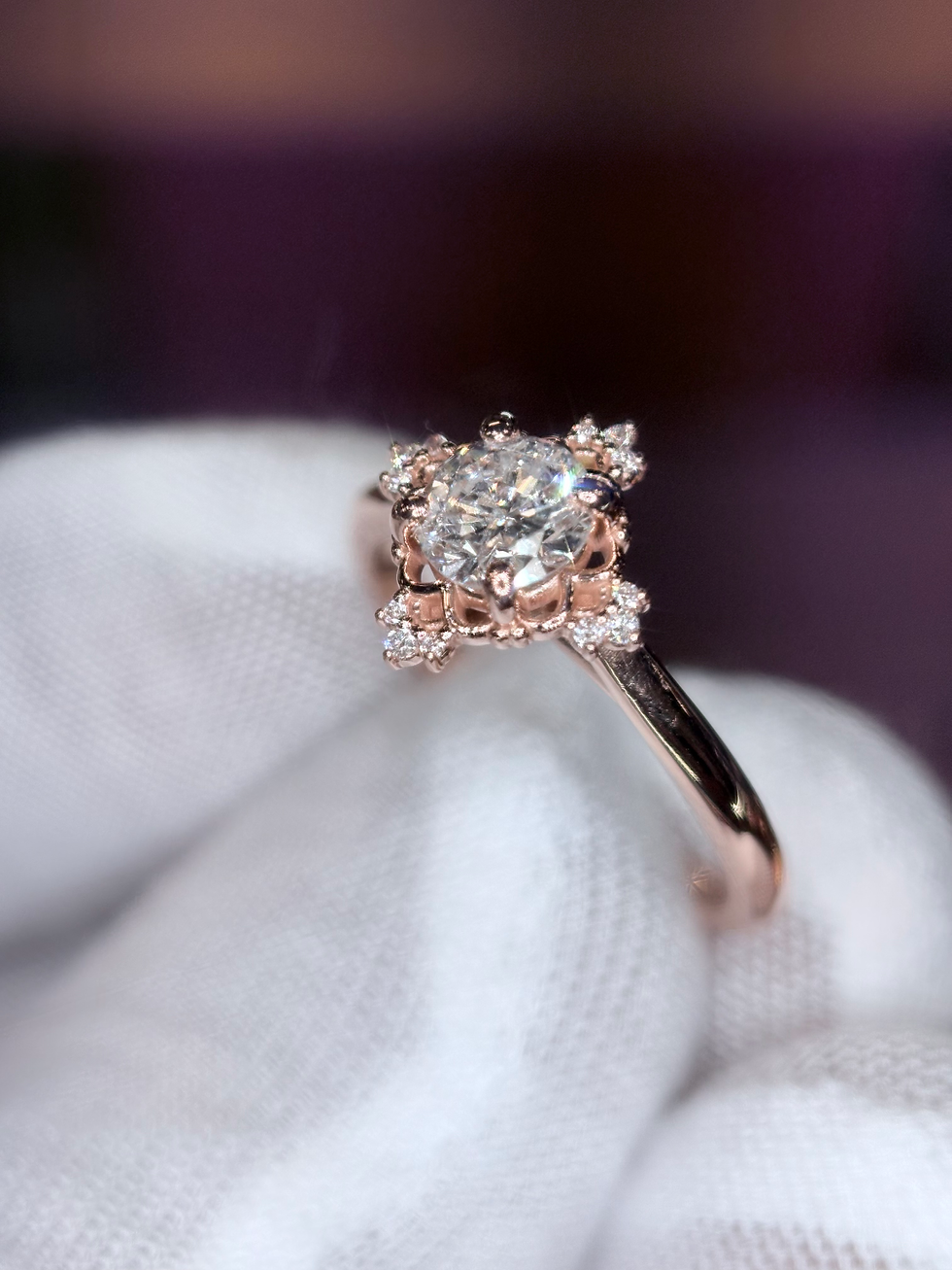 Thumbnail: Lab-grown diamond stud earring held in a gloved hand