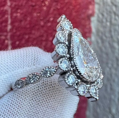 Thumbnail: Profile of a pear-shaped lab-grown diamond ring in 14K gold.