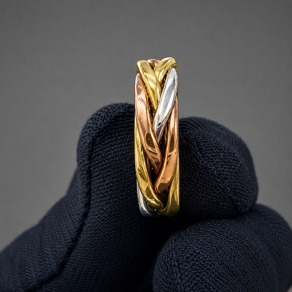 Thumbnail: Tri-color braided puzzle ring held by a gloved hand