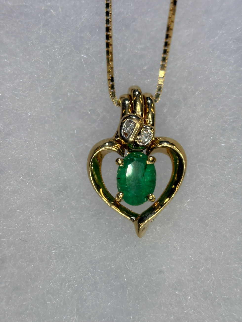 Thumbnail: Gold heart pendant with oval emerald and diamond accents
