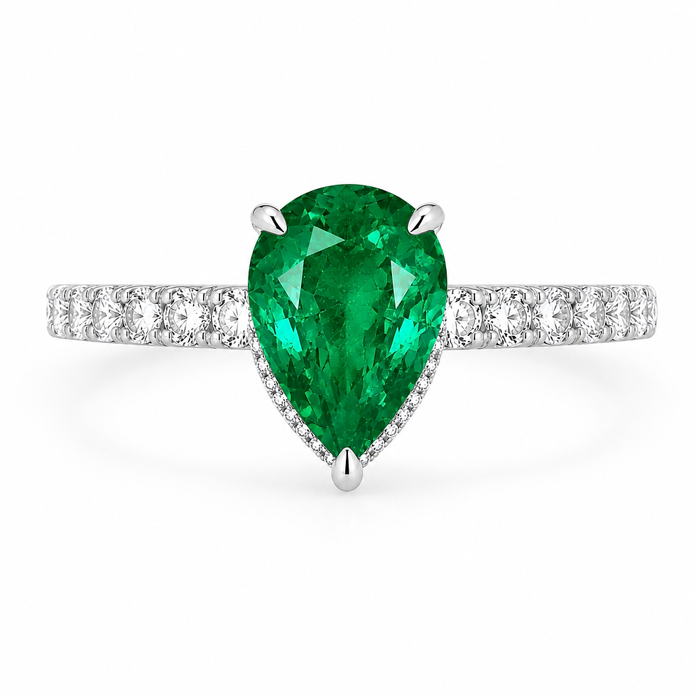 Pear-cut emerald on a diamond-set platinum band