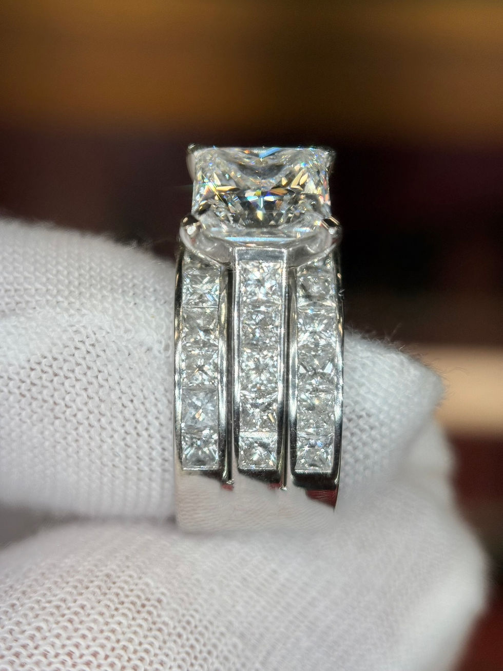 Thumbnail: Wide diamond band with princess cut center stone