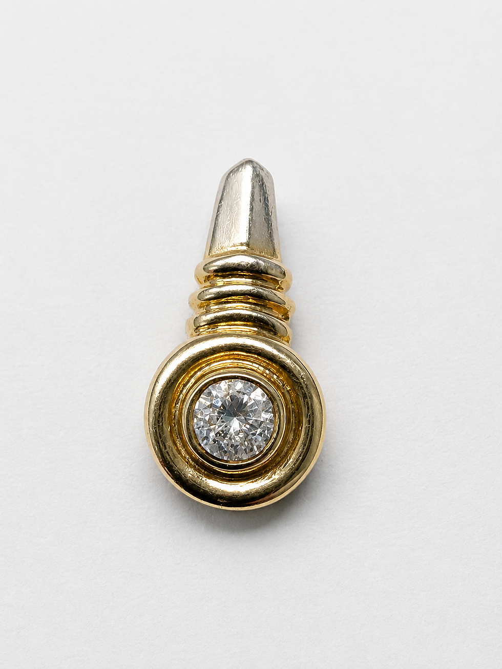 1ct natural diamond in a 10K yellow gold bezel setting