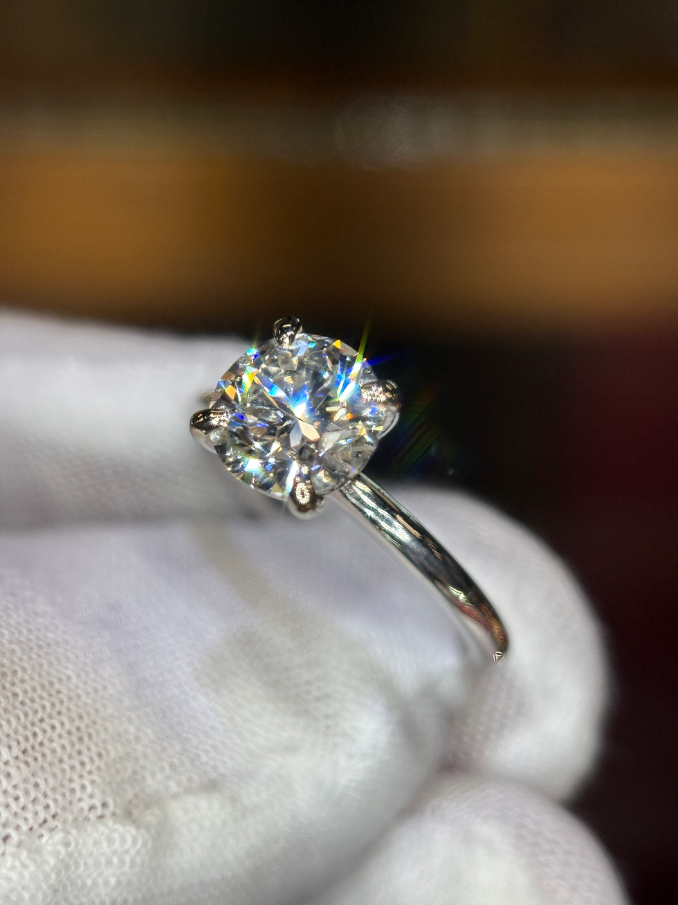 Thumbnail: Sparkling round-cut diamond solitaire ring on a silver band