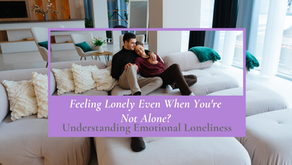 A couple holding hands and cuddling on a couch, illustrating the emotional safety and secure connection.