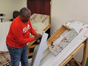 Reviewing roofing material samples with KFR Roofing Solutions