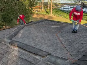 KFR Roofing Team working on a shingled roof