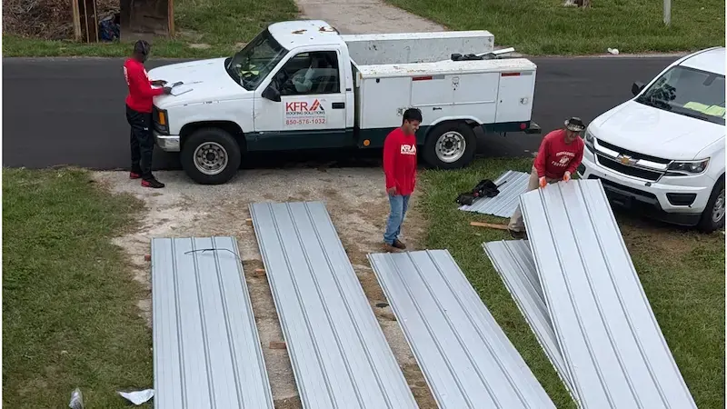 a metal roof panel roofers wearing KFR Roofing Solutions.