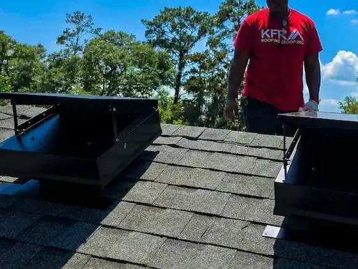 kfr roofing team installing solar vents for a clients roof