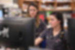 Two veterinarians at VEG ER for Pets review a patient's results on a computer screen.