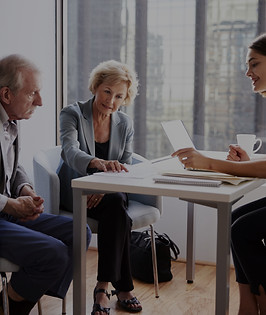Couple Sitting with Financial Advisor_edited.jpg