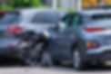 Car crashed into parked car on neighborhood street.jpg