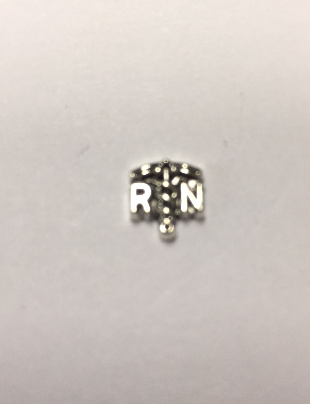 R N, in silver color