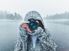 Photographer in freezing cold winter