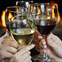 Group of happy young people drink wine