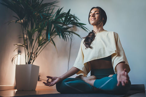 Woman meditating and doing somatic nervous system regulation exercises