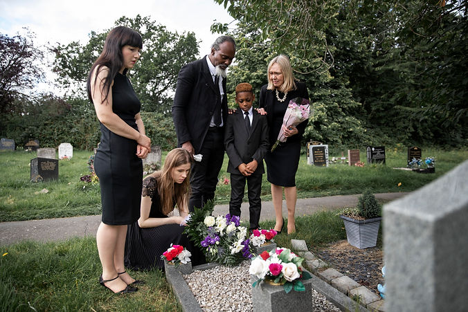 family-visiting-grave-loved-one.jpg