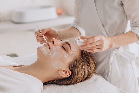 cosmetologist-doing-face-treatment-applying-face-mask.jpg