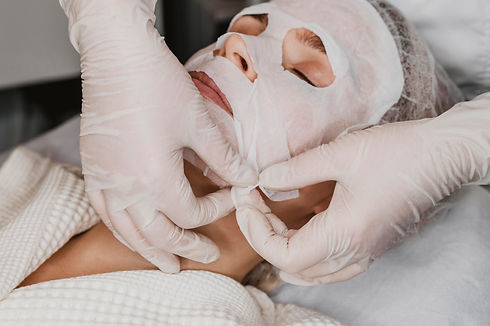 young-beautiful-woman-getting-skin-mask-treatment-spa.jpg