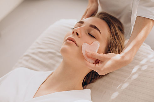 woman-salon-making-beauty-treatment-with-gua-sha-stone.jpg