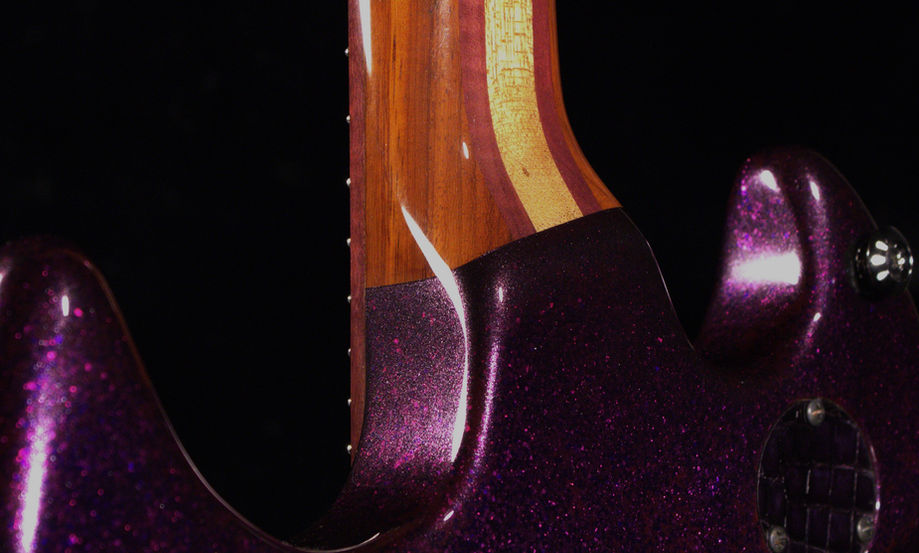 EA 24 Purple Sparkle Guitar Neck joint smooth contour close up Back Paduak with reclaimed mahogany purple heart