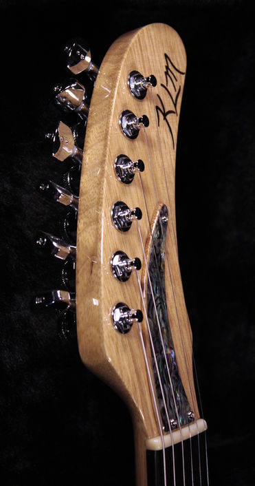 EA 24 Black Cherry Headstock front Korina abalone cover & bois de rose inlay angle