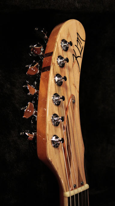 EA 24 Translucent ruby red guitar Headstock with ambrosia maple ebony inlay & graphtech ratio tuning keys