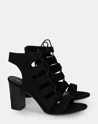 A pair of chic black high heels from Wildfire Shoes featuring a bold block heel, lace-up front, and stylish cut-out details for a trendy and elegant look.