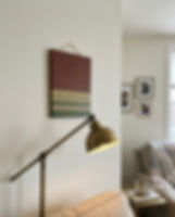 rust olive green wall art in luxury home setting Arakku