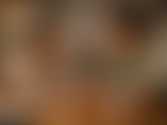 Asian couple having a calm conversation at a kitchen table demonstrating secure communication in a healthy relationship