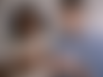 Black woman looking concerned while partner appears emotionally withdrawn, illustrating an anxious–avoidant relationship dynamic.