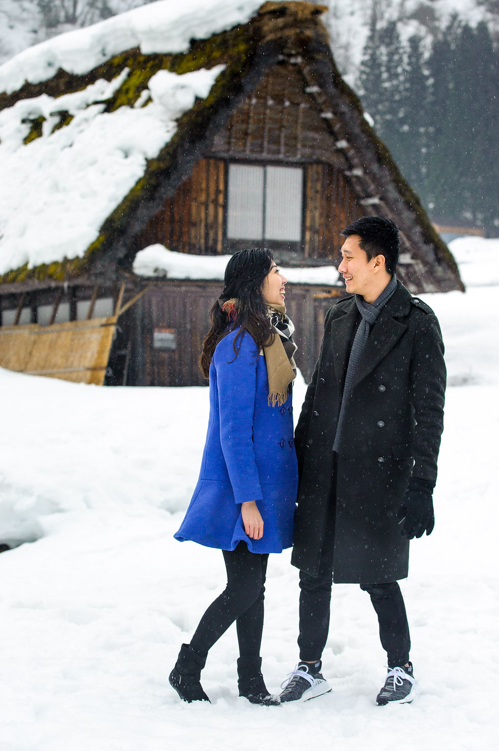 Mira and Sin laugh at each other in the snow