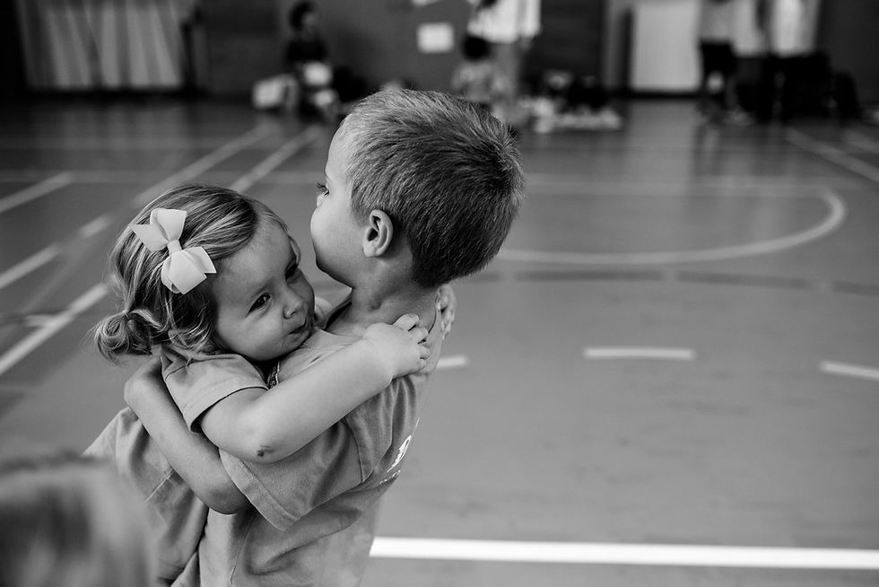 Clara and Dean embrace at the end of Sports day