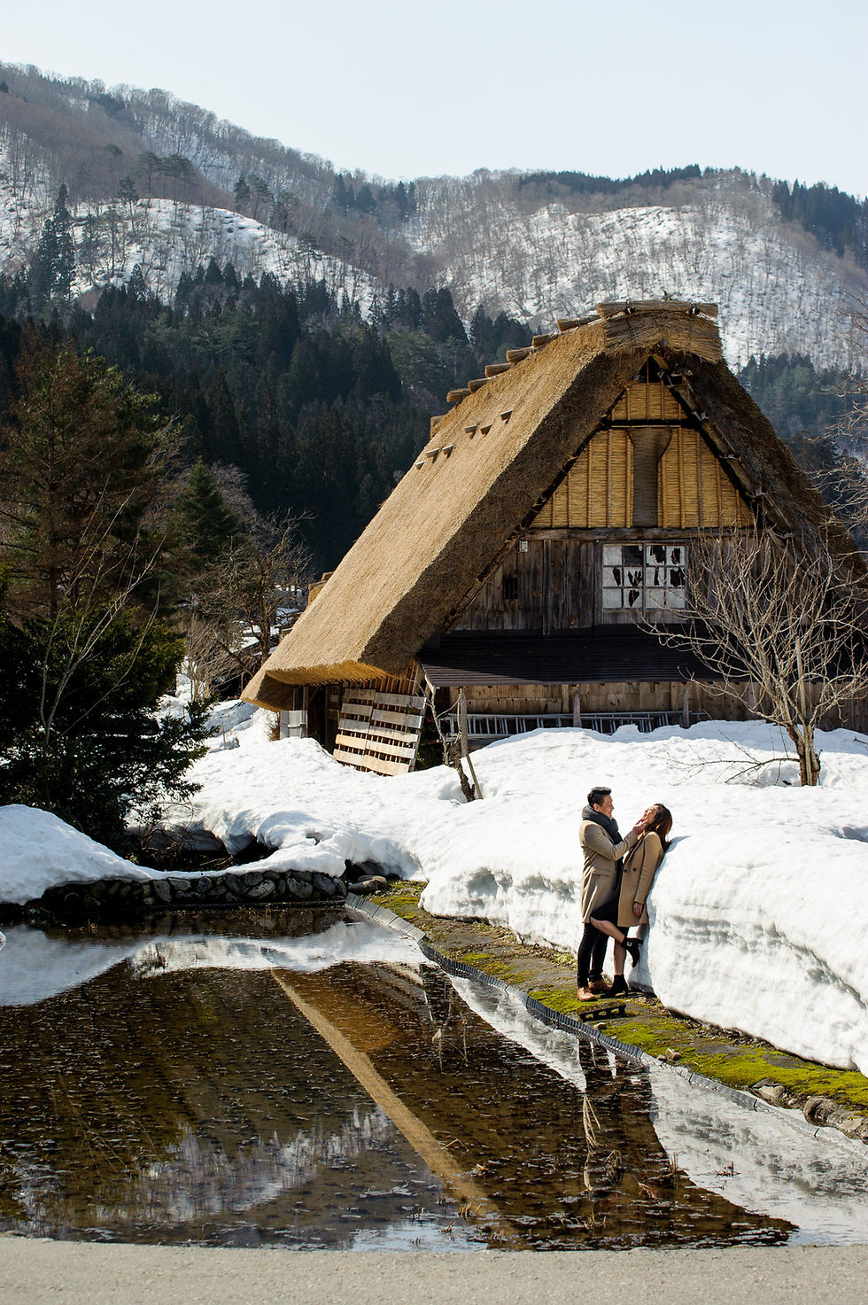 Vivi and Mika and the gassho hut and reflection