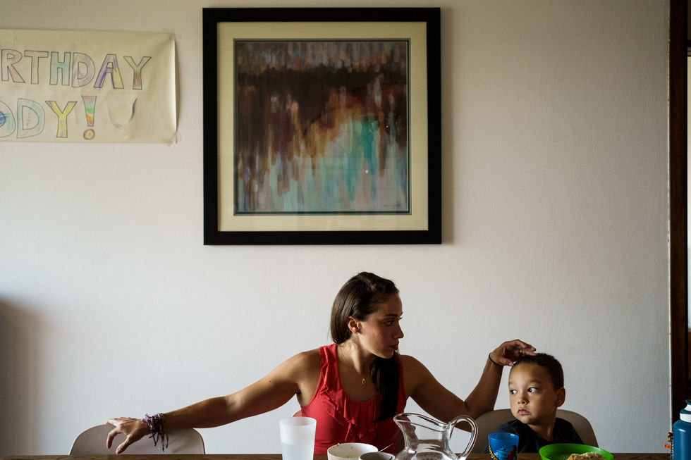 mom and boy at the table eating lunch