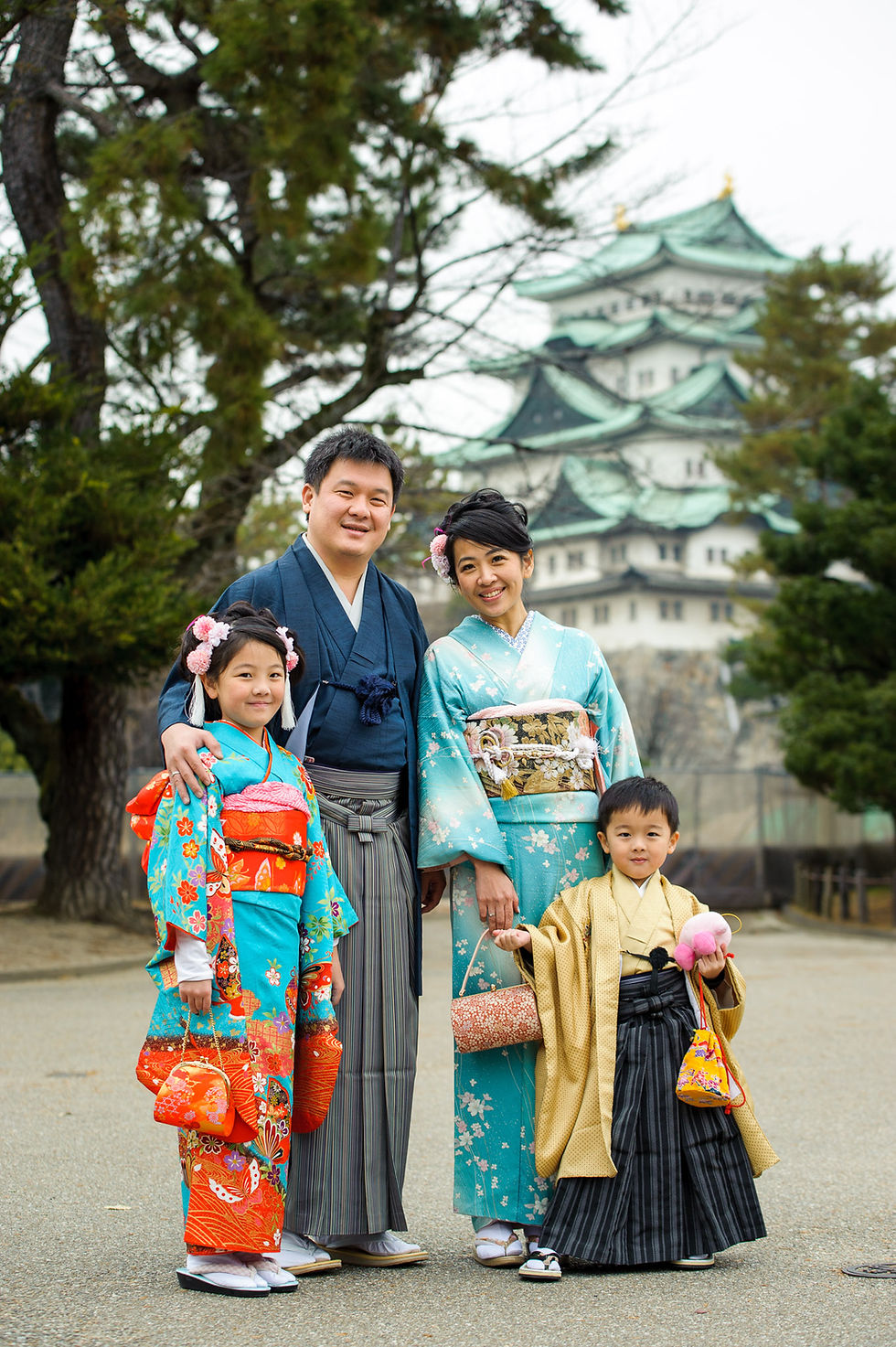The Permana Family poses in front of the Nagoya castle in their kimonos